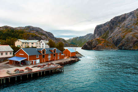 Nusfjord, Norway. View of the port and the pier in autumn. Azure water.の写真素材