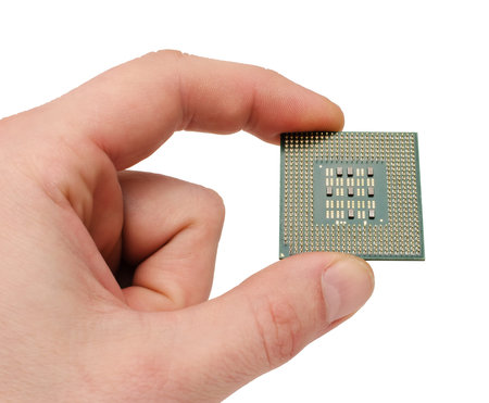 the processor on a hand of the person on a white background