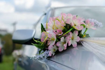 cars are decorated with wedding bouquets of beautiful flowersの写真素材