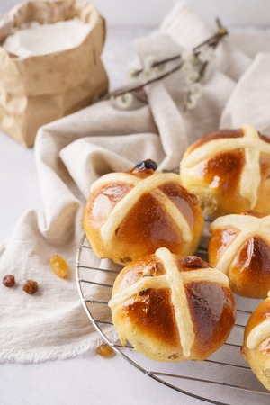 Homemade hot cross buns for breakfast. Sweet treats for Easter celebration.の写真素材