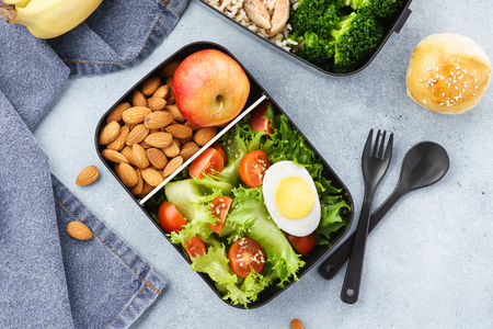 Various lunch boxes with healthy food and ingredients. Takeaway or delivery concept.の写真素材