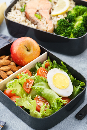 Lunch boxes with food ready to go for work or school. Meal preparation or dieting concept.の写真素材