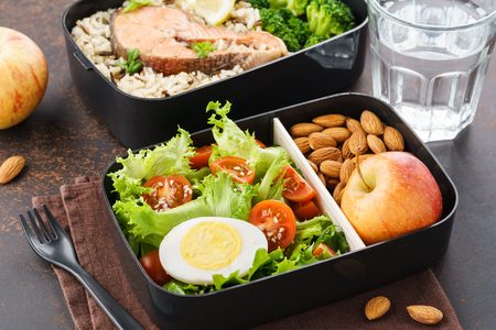 Lunch boxes with food ready to go for work or school. Meal preparation or dieting concept.の写真素材