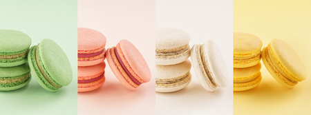 Food collage of colorful macarons on same color backgrounds. Pink, yellow, green and white. Creative banner.の写真素材