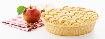Homemade apple pie, apples, cinnamon and red checkered tablecloth on white background. Traditional American pastry for Thanksgiving Day. Banner.の写真素材