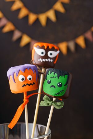 Funny cake pops monsters for Halloween party. Festive sweets. Selective focus.の写真素材