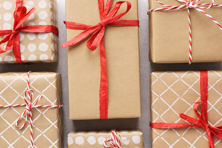 Various decorated gift boxes on light gray background. Flat lay.
