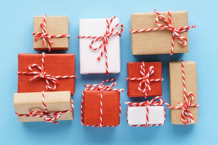 Collection of handcrafted gift boxes on light blue background. Flat lay.の写真素材
