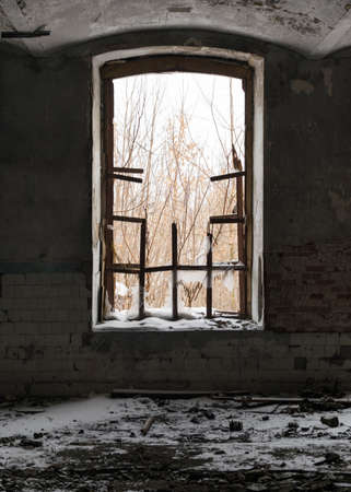 Abandoned factory premises with a broken window.の写真素材