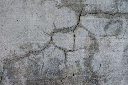 Gray wall cracks. Background.の写真素材