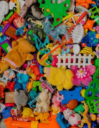 Bunch of scattered colored small toys.Background.の写真素材
