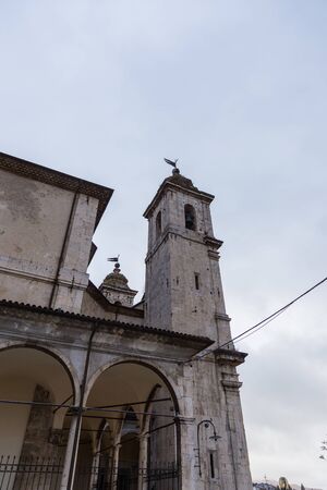 Castel di Sangro, Abruzzo, Italy. October 13, 2017. Basilica of Saint Mary enjoys the ancient fifteenth century loggia and a 14th century high relief depicting the Piet within the porchの写真素材