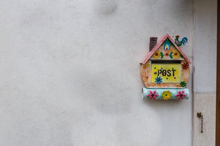 Villetta Barrea, Abruzzo, Italy. October 13, 2017. Artistic decorations attached to the wall of a dwellingの写真素材