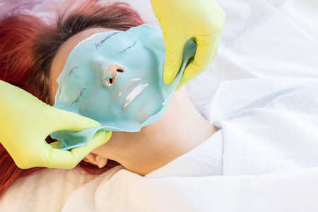beautiful girl holding syringes. The concept of beauty services,  skin care, modern fashionの写真素材