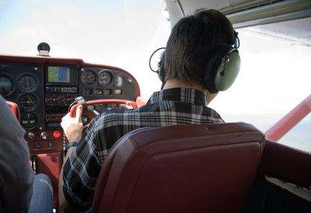 boy fliyng in the plane cabin