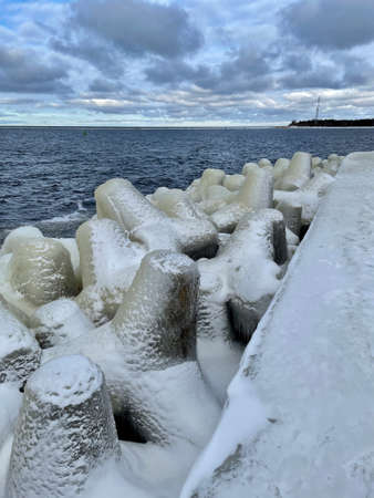 Baltic Sea winter coast beach Daugavgriva pier Latviaの写真素材