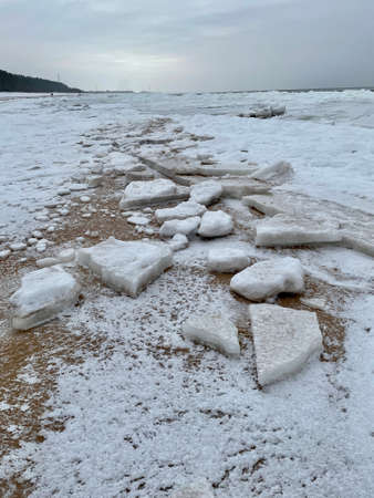 Baltic Sea winter coast beach Daugavgriva pier Latviaの写真素材