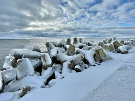 Baltic Sea winter coast beach Daugavgriva pier Latviaの写真素材