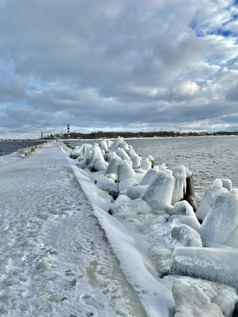 Baltic Sea winter coast beach Daugavgriva pier Latviaの写真素材