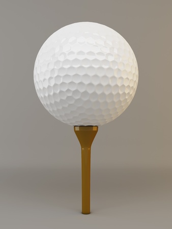 Single white golf ball on brown teeの写真素材