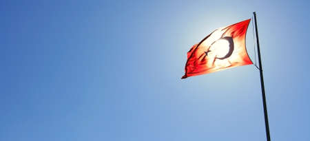 Turkish Flag And Sun Behind Itの写真素材
