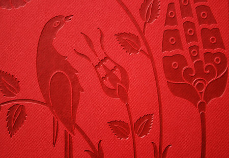 Flower and bird figures on red background