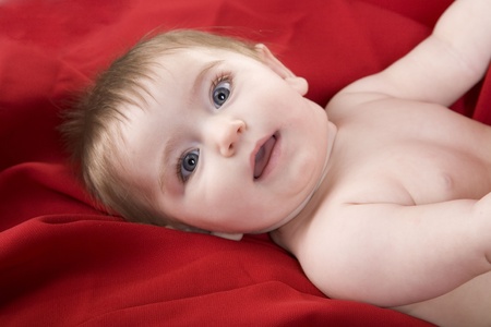 Baby girl on Redの写真素材