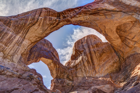 Beautiful Double Arch Photographed in the morning sun at Arches National Park near Moab Utah.の写真素材