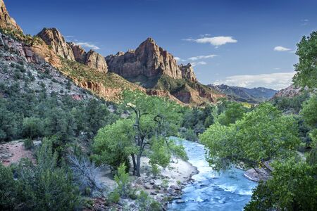 Sunset falls over Zion Canyon and the Virgin River in Utah.の写真素材