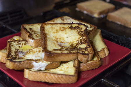 French toast being cookedの写真素材