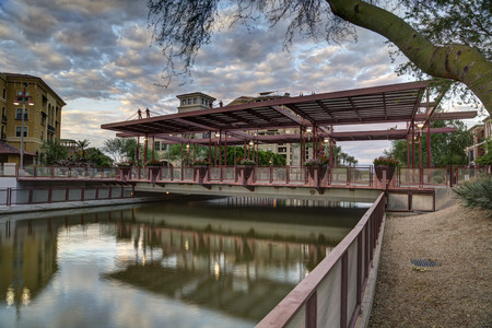 Scottsdale, Arizona USA - August 20, 2017: South Bridge over the Salt River Project canal at the Scottsdale Arizona Waterfront District photographed at sunset.のeditorial素材