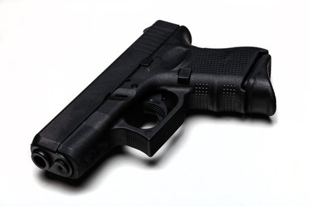 Automatic 9mm pistol isolated on a white background