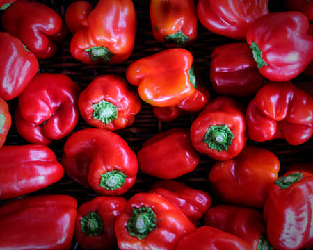 Organic red bell peppers for sale at a local farmerâs market.の写真素材