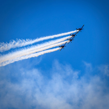 Four Planes Performing Aerobatics at the Buckeye Air Show in at the Airport in Buckeye Arizona.のeditorial素材