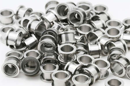 A big pile of screw on flesh tunnels. These are used in stretched ear lobes.の写真素材