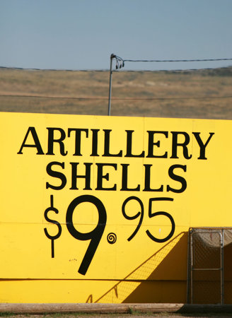 A sign advertising Artillery Shells for just $9.99. A great price to blow up whatever you had in...