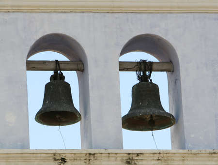 Giant bells high up on a church towerの写真素材