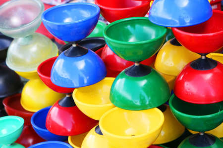 A stack of colorful diablo toysの写真素材