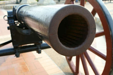 Looking down the barrel of an antique cannonの写真素材