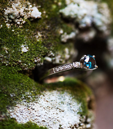 A close-up shot of a beautiful blue wedding ring