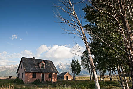 Mormon house below Grand Teton mountain rangeのeditorial素材