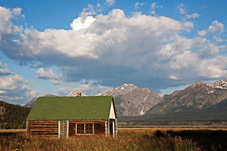 Log Cabin below Grand Teton mountain range in Wyoming, USAのeditorial素材