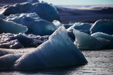 Melting glacier ice at Jokulsarlon lake caused by global warming
