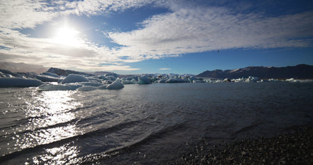 Melting glacier ice at Jokulsarlon lake caused by global warming