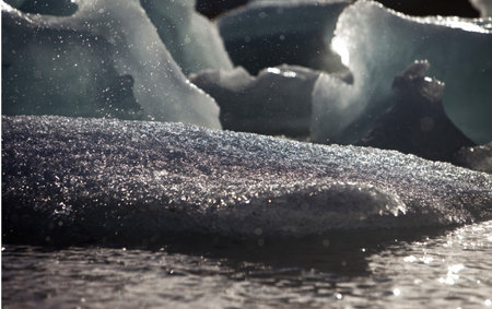 Melting glacier ice at Jokulsarlon lake caused by global warming