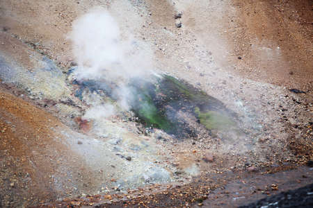 Volcanoes create a bizarre landscape of rhyolite rocks and green moss along the Landmannalaugar trekの写真素材