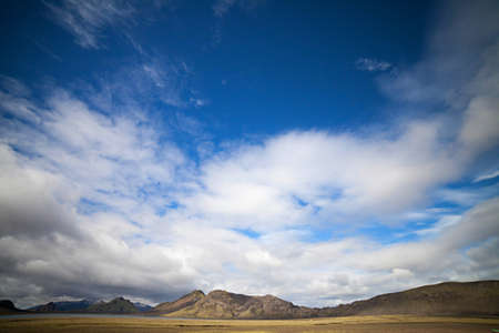 Volcanoes create a bizarre landscape of rhyolite rocks and green moss along the Landmannalaugar trekの写真素材
