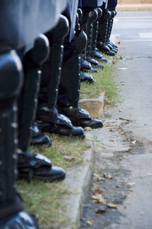 Special police forces cordon at the demonstration blocking street protestsの写真素材