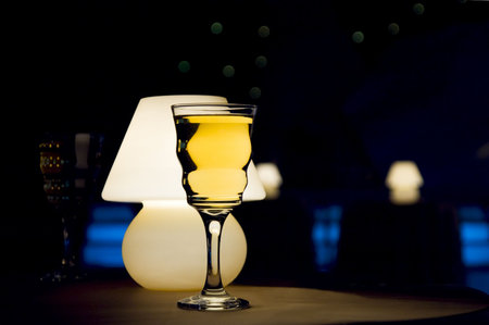 Romantic evening in restaurant with white wine and lamp