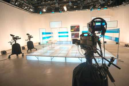 Television studio with camera and lightsの写真素材